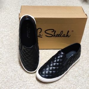 Quilted black slip-on sneakers